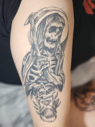 Find women's rib tattoo ideas for your next unique tattoo in Minersville at Foundation Tattoo & Art Studio