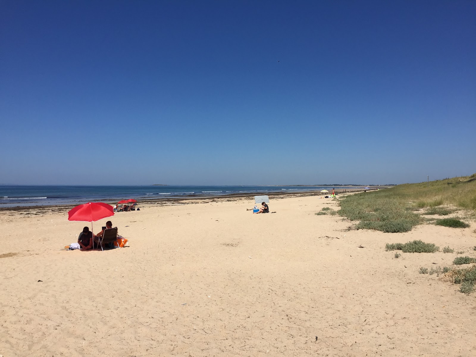 Fotografija Beach Mane Guen z svetel pesek površino