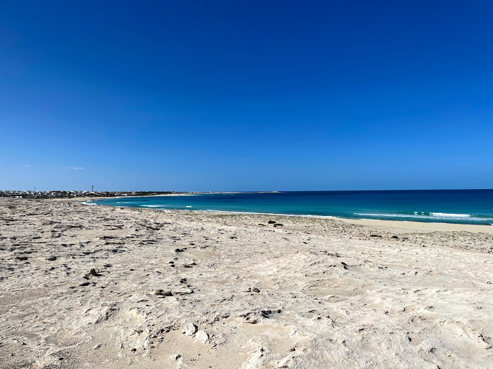 Foto av Golgota Beach med lång rak strand