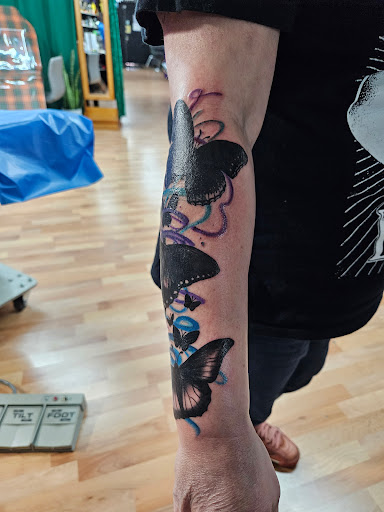 Explore 2 sons tattoo ideas, creative tattoo ideas in Benton, available at Spectrum Tattoo