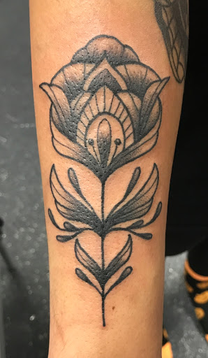 Explore cover up lower back tattoo ideas, creative tattoo ideas in Clarksville, available at Vanilla Gorilla Tattoo