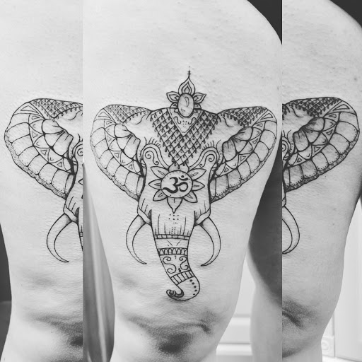 Explore upper back tattoo ideas, creative tattoo ideas in Traverse City, available at Pinups & Needles