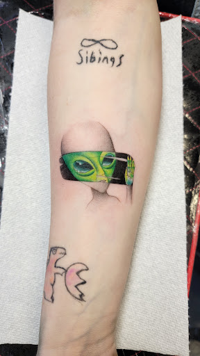 Explore lily tattoo ideas, creative tattoo ideas in Kalispell, available at Swindler Ink