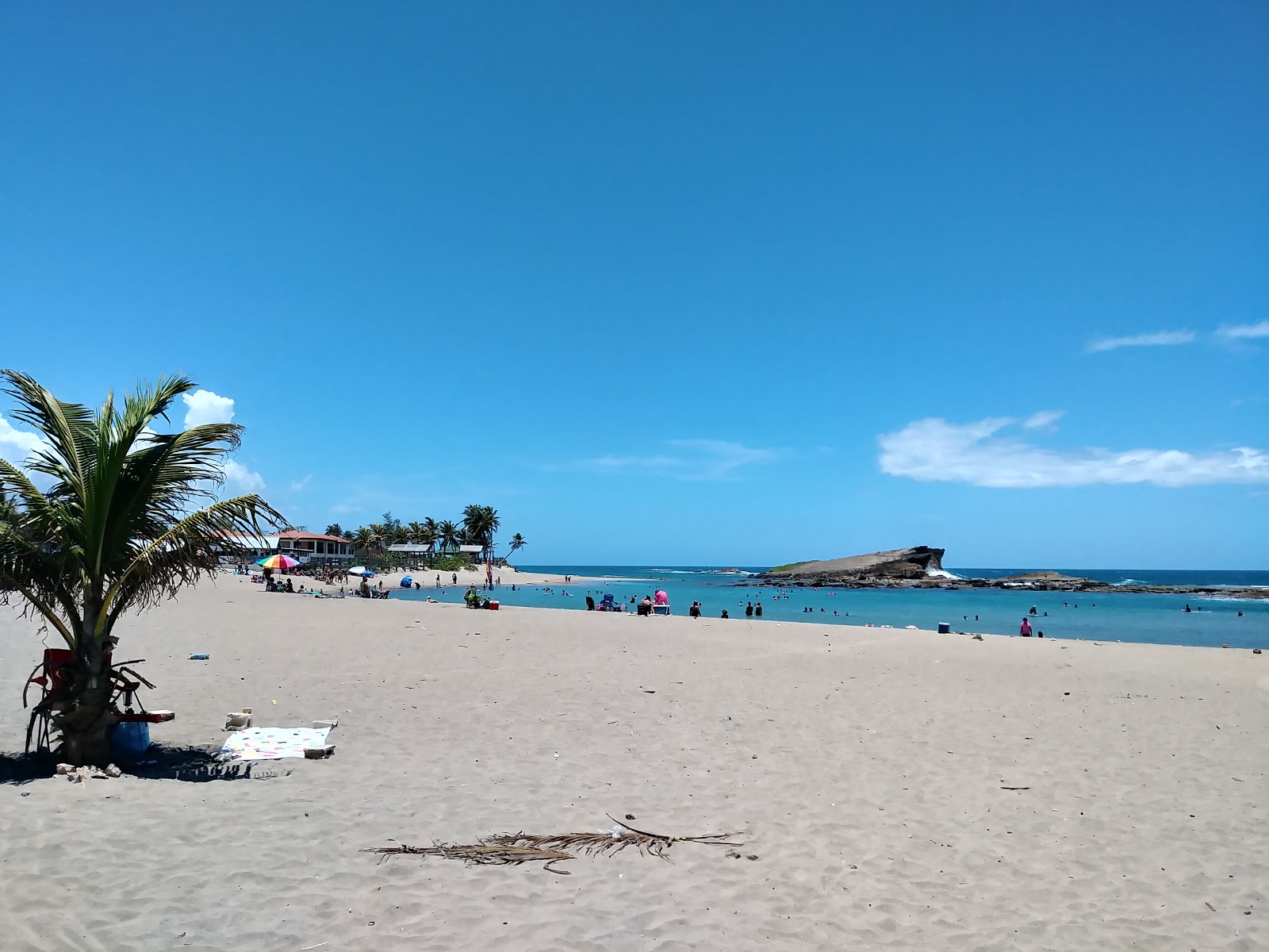 Foto van Playa Sardinera met helder zand oppervlakte