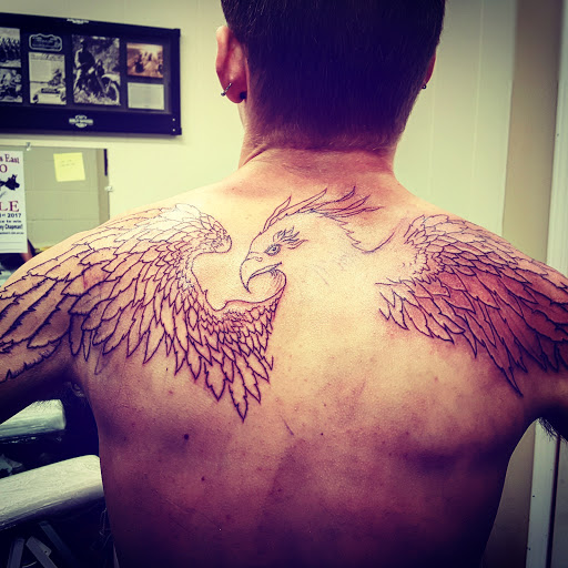 Explore hand wrist tattoo ideas, creative tattoo ideas in Hays, available at Fantasy Graphics Tattoo Studios