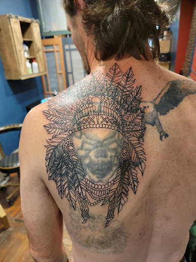 Explore charizard tattoo ideas, creative tattoo ideas in Pottsville, available at Abaddon Studio Tattooing & Piercings