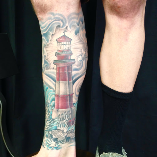 Explore wedding band tattoo ideas for him, creative tattoo ideas in Peoria, available at Iron Key Tattoo Studio Inc.