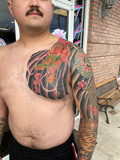 Explore thigh tattoo ideas for men, creative tattoo ideas in Saint Marys, available at Empire Tattoo