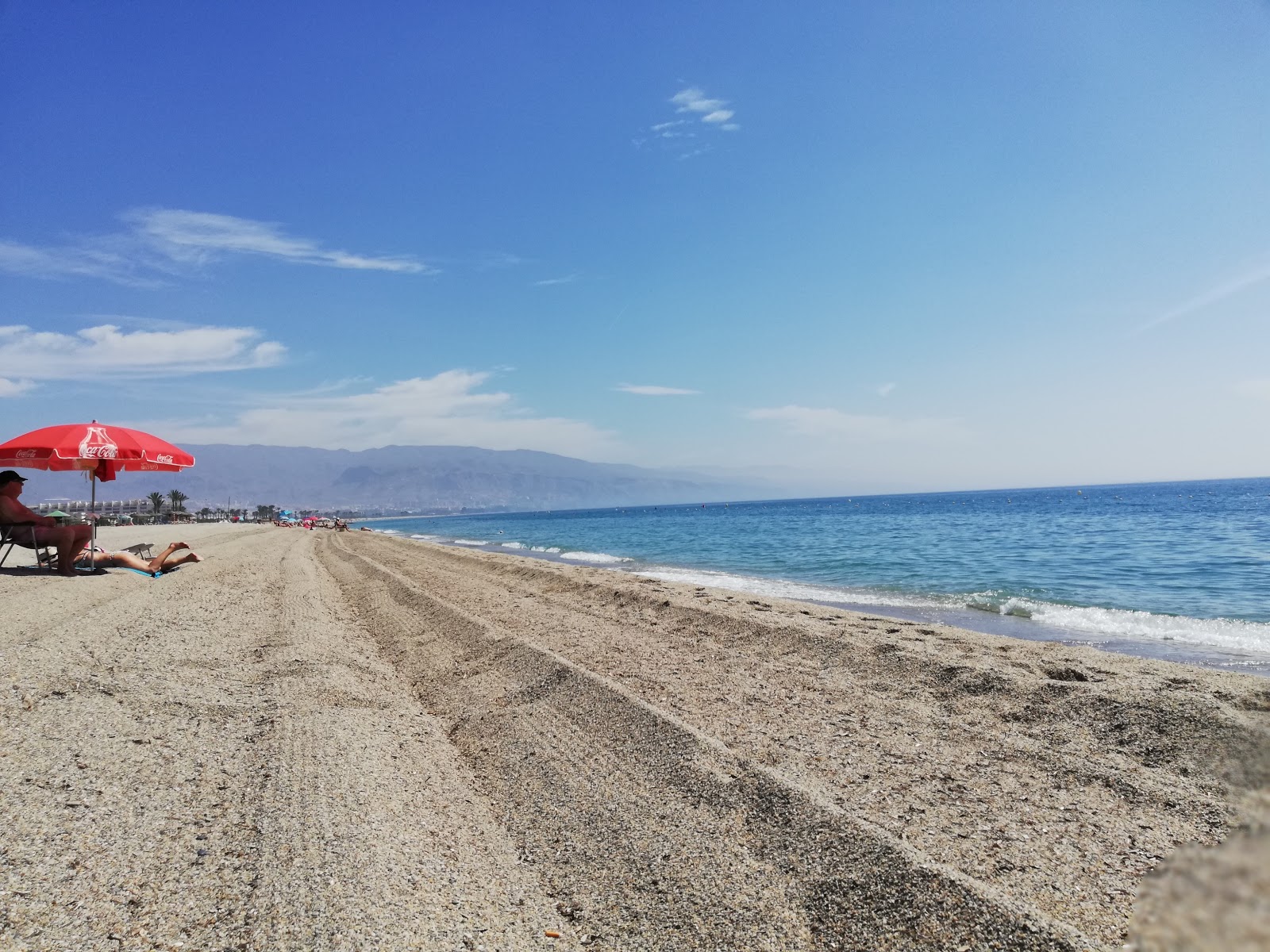 Photo of Playa de la Romanilla and the settlement