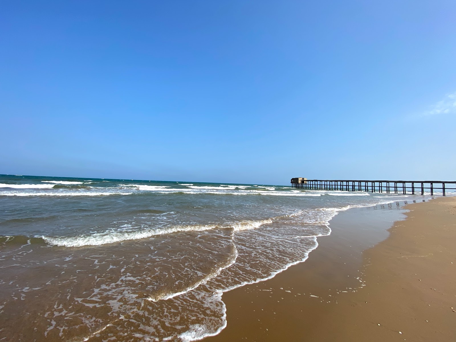 Photo de Zard Beach avec rivage droit, long