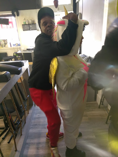 Explore afro tattoo ideas, creative tattoo ideas in Atlanta, available at Iron Palm Tattoos & Body Piercing Atlanta