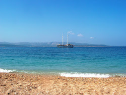 Paklina FKK Beach'in fotoğrafı düz bir kıyı şeridi ile birlikte
