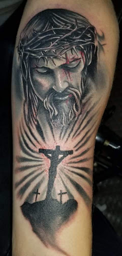 Explore women's leg tattoo ideas, creative tattoo ideas in Angola, available at Hoodlum Ink