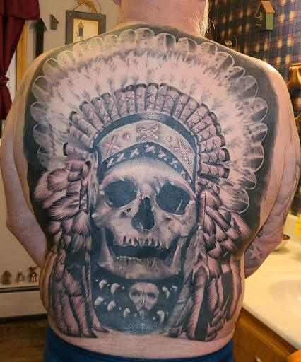 Explore chest cross tattoo ideas, creative tattoo ideas in New Castle, available at Underdogs Tattoo Gallery