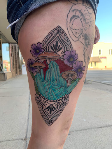 Explore tattoo ideas for females on hips, creative tattoo ideas in Cass City, available at Wolf Zen Tattoo