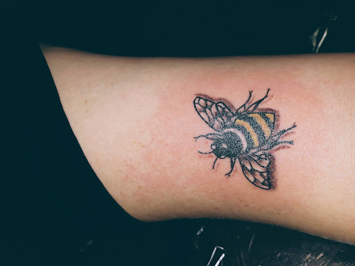 Explore grease tattoo ideas, creative tattoo ideas in Newport, available at T N T Explosive Tattoo