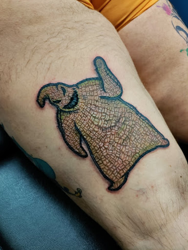 Explore neck word tattoo ideas, creative tattoo ideas in Westland, available at Premier Tattoo Company Westland