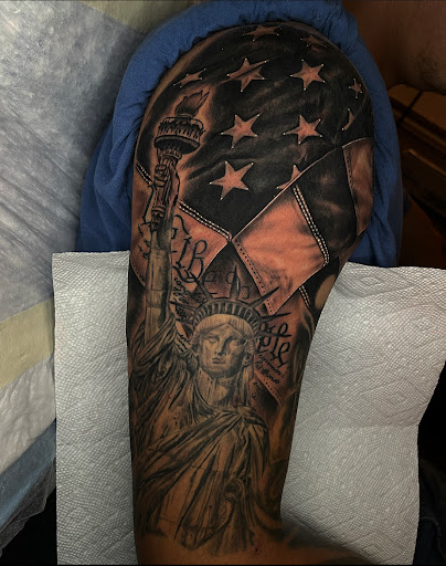 Explore middle of boob tattoo ideas, creative tattoo ideas in Lakeview, available at Backwoods Tattoo Studio