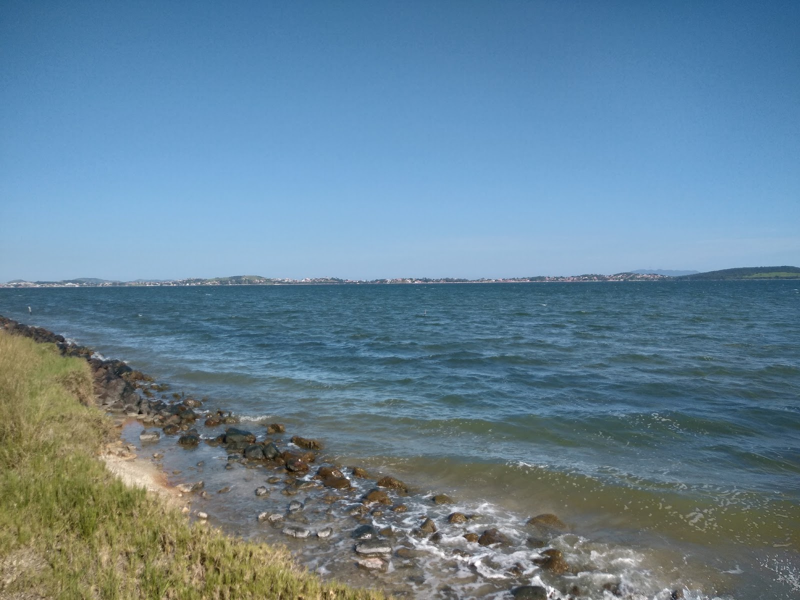 Fotografija Praia Ponta DAgua z turkizna čista voda površino