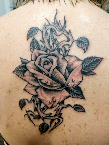 Explore head tattoo ideas for females, creative tattoo ideas in Middle Village, available at True Blue Tattoo