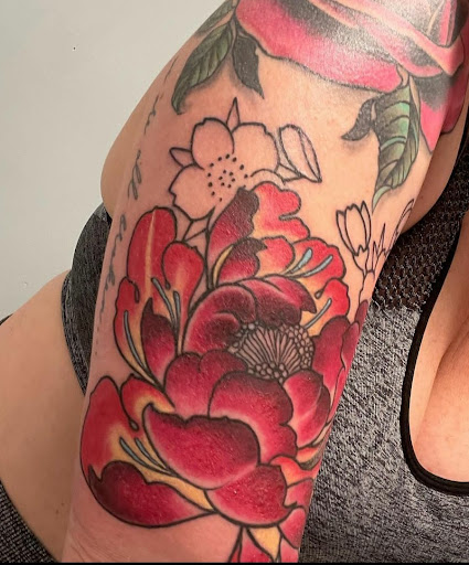 Explore curious george tattoo ideas, creative tattoo ideas in Orange Park, available at All Aces Tattoo and Body Piercing LLC