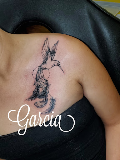 Explore cross tattoo ideas for females, creative tattoo ideas in Kearney, available at Ink Shop Tattoos & Piercings