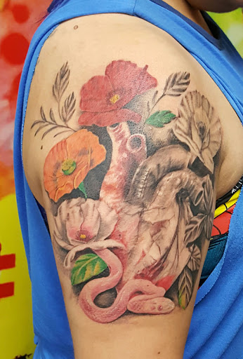 Find web tattoo ideas for your next unique tattoo in Fresno at Happy Client Tattoo