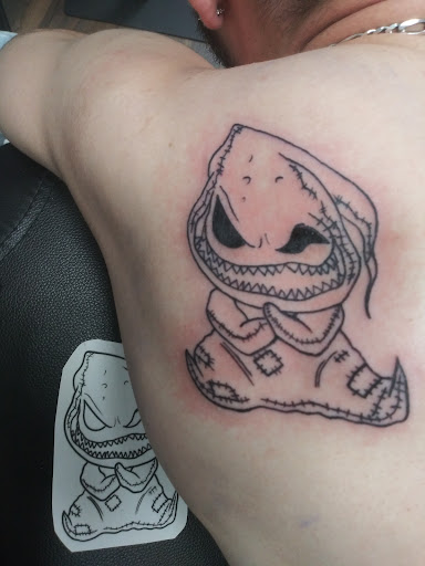 Explore back leg tattoo ideas, creative tattoo ideas in Ocala, available at Black Lotus Tattoo & Art Gallery Inc