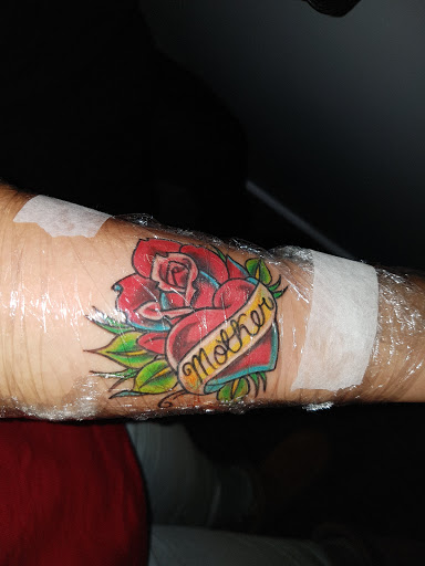 Explore chest tattoo lettering ideas, creative tattoo ideas in Mastic, available at Crystal Blue Tattoo