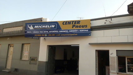 Center Pneus / - Edmundo Catalan Larratea