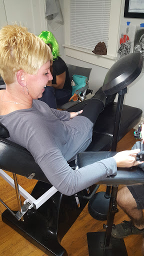 Explore bookish tattoo ideas, creative tattoo ideas in Charlotte, available at Black Cloud Tattoo & Piercing