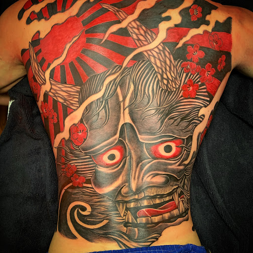 Explore black power tattoo ideas, creative tattoo ideas in Arcadia, available at Peter Gunz Tattoo Studio