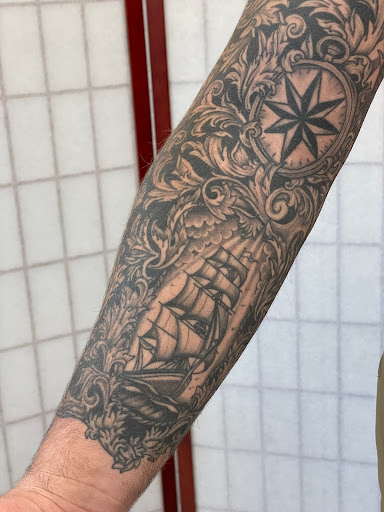 Explore small tattoo ideas for men arm, creative tattoo ideas in Oshkosh, available at Easy Street Tattoo
