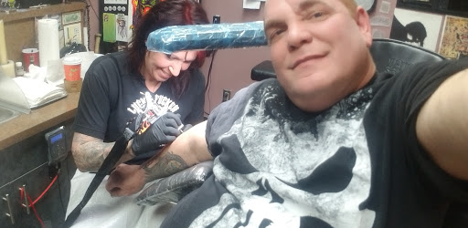 Explore paintbrush tattoo ideas, creative tattoo ideas in Ronkonkoma, available at Studio 69 Tattoo