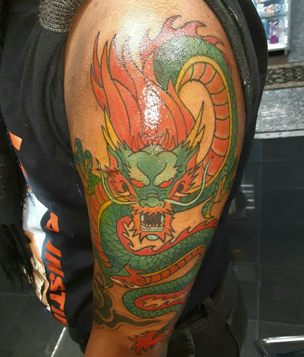 Explore cute neck tattoo ideas, creative tattoo ideas in Jackson Heights, available at Village Moon Tattoo & Body Piercing