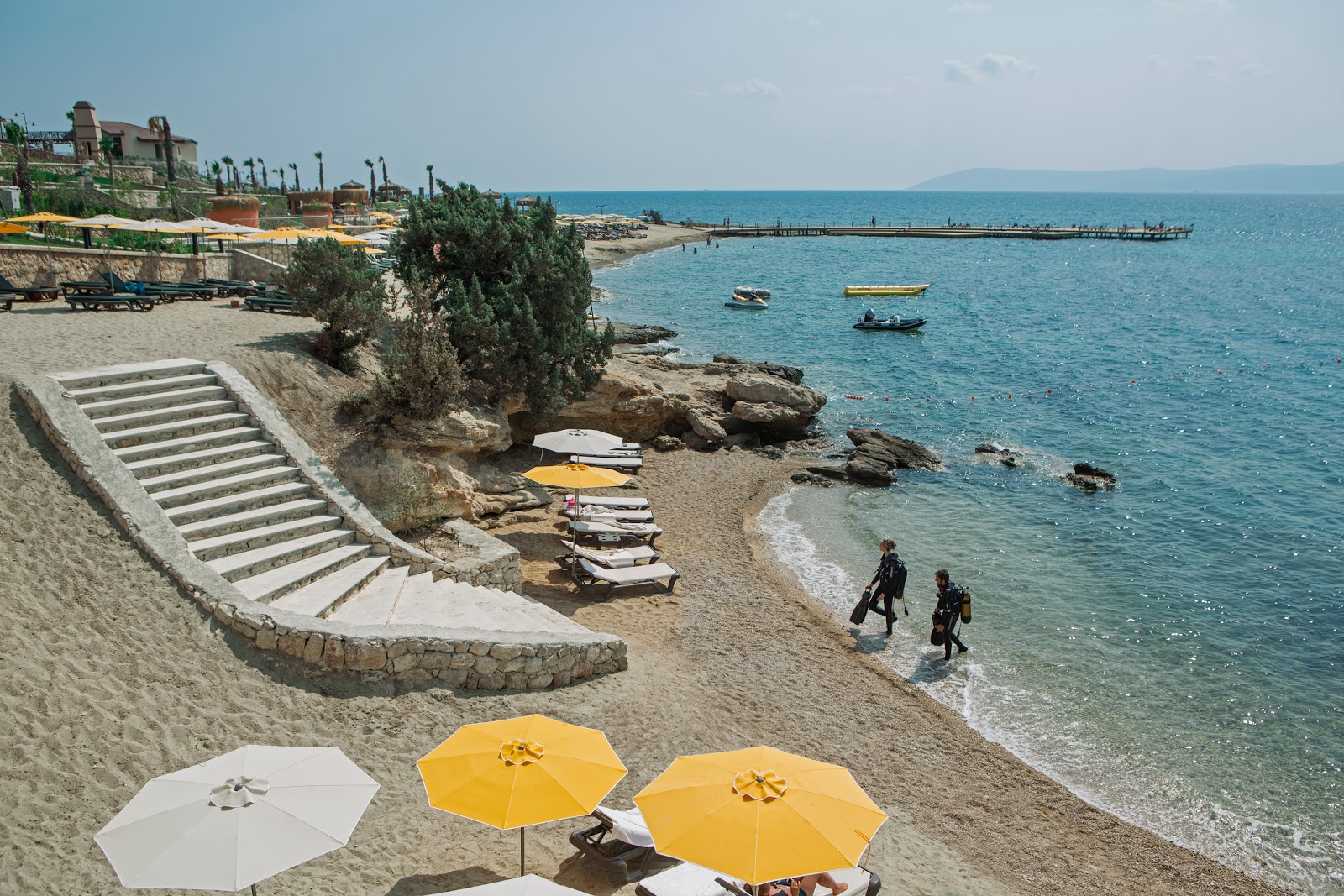 Foto af Mukka Beach II med lyst sand & sten overflade