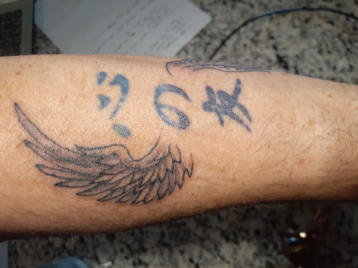 Explore sinister tattoo ideas, creative tattoo ideas in Buford, available at Wild Tribe Tattoos and Piercings