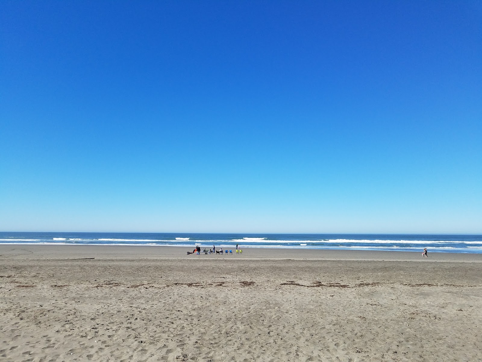 Foto van Westport Beach met recht en lang