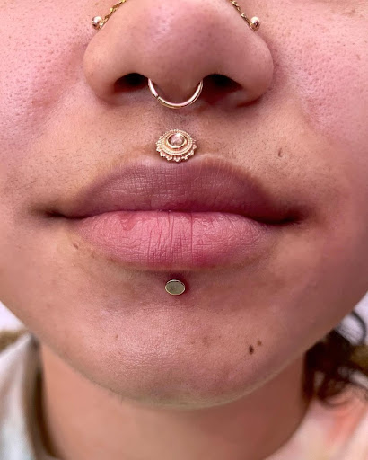 Explore chin tattoo ideas, creative tattoo ideas in New York, available at Cherry Bomb Tattoo & Piercing Studio - Walk-Ins Welcome