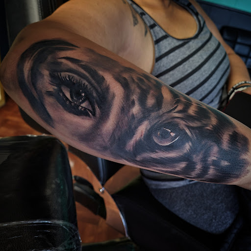 Explore ghost tattoo ideas, creative tattoo ideas in Corning, available at Prisma Ink Tattoos & Piercings