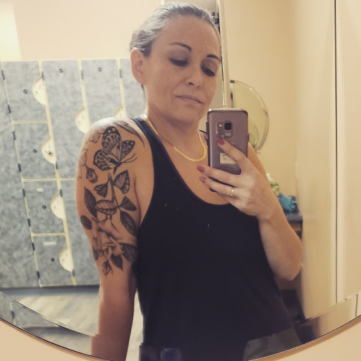 Explore purple flower tattoo ideas, creative tattoo ideas in Woodstock, available at Woodstock Tattoo Studio