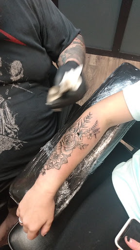 Explore apple tattoo ideas, creative tattoo ideas in Barre, available at Bury The Needle Tattoo