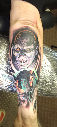 Explore urban tattoo ideas for men, creative tattoo ideas in Angola, available at Hoodlum Ink