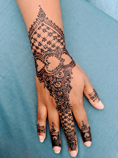 Explore 2003 tattoo ideas, creative tattoo ideas in Concord, available at Naseera Fazil Henna Art