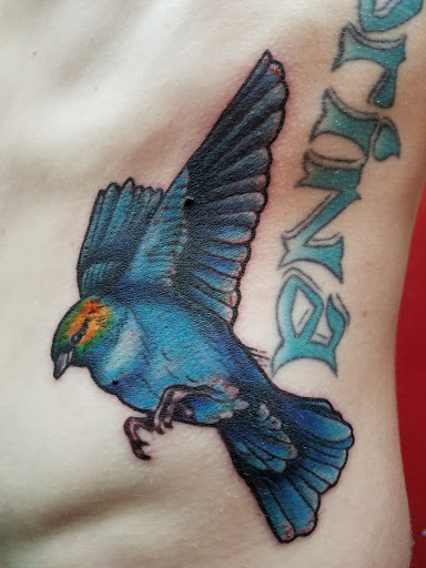 Explore skull tattoo cover up ideas, creative tattoo ideas in Kennewick, available at Hoops Tattoo and Piercing