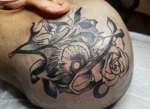 Explore joker hand tattoo ideas, creative tattoo ideas in Livingston, available at Speakeasy Tattoo