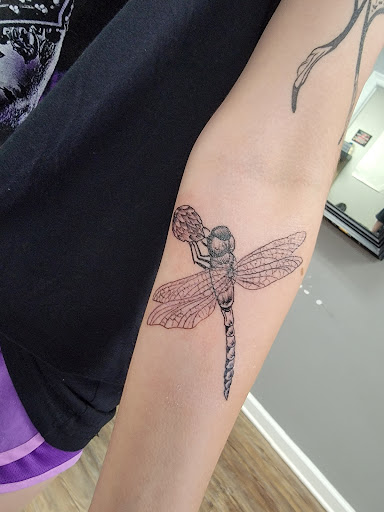 Explore rip cross tattoo ideas, creative tattoo ideas in Butler, available at Red Spade tattoo