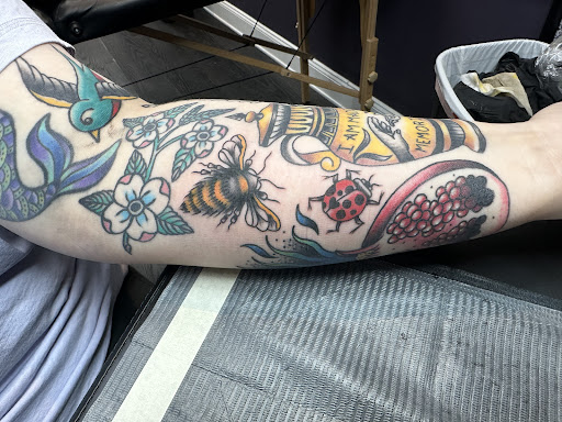 Explore spine tattoo cover up ideas, creative tattoo ideas in Erie, available at Lake Effect Tattoo Parlour