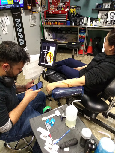 Explore grinch tattoo ideas, creative tattoo ideas in Kenosha, available at Kenosha Tattoo Company