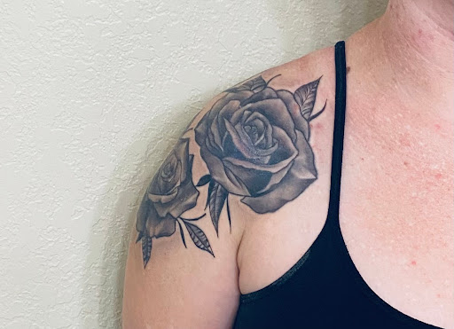 Explore flower shoulder tattoo ideas, creative tattoo ideas in Valrico, available at Blackline Tattoo Company